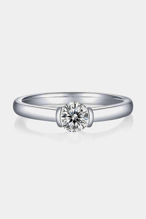 a white gold engagement ring with a single diamond