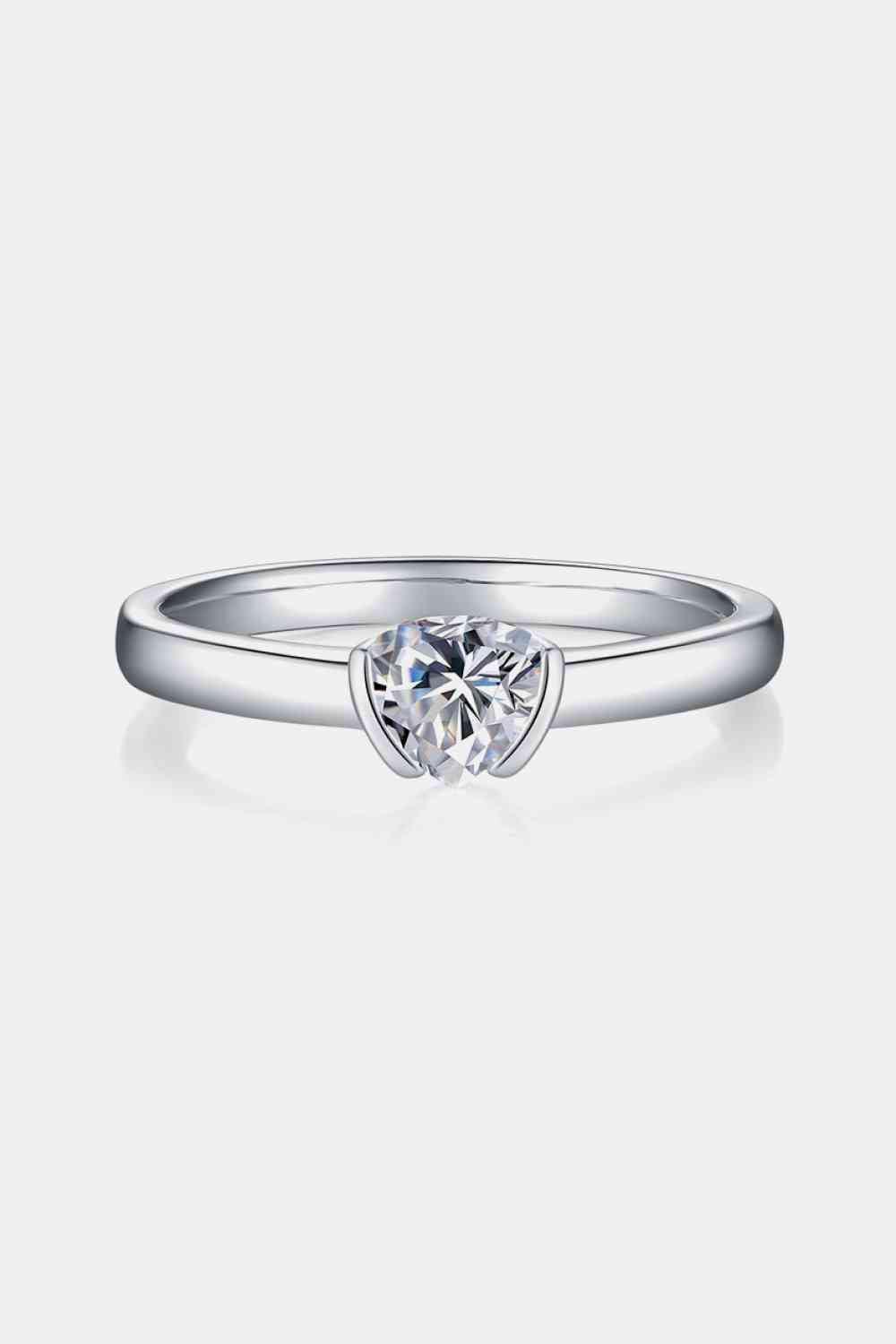 a white gold engagement ring with a single diamond