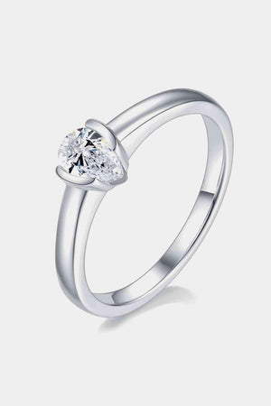 a heart shaped diamond ring on a white background