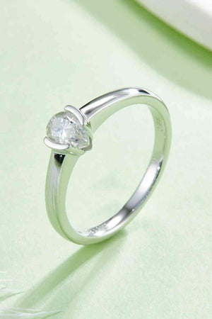 a white gold ring with a heart shaped diamond