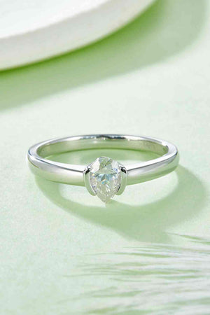 a close up of a diamond ring on a table