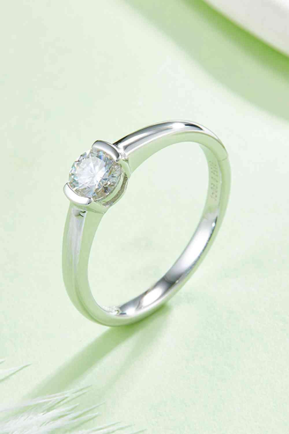 a close up of a diamond ring on a table