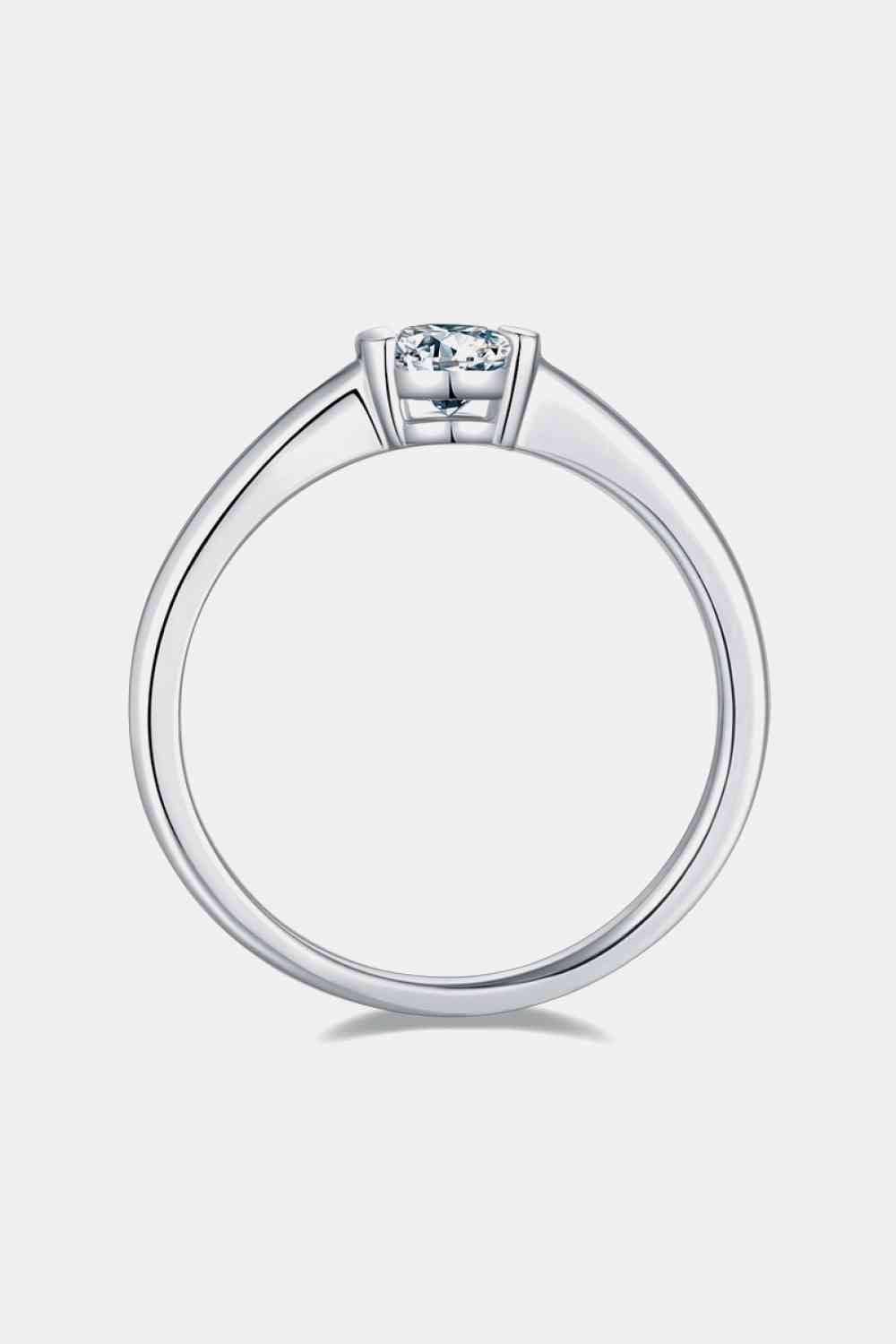 a white gold ring with a square cut diamond