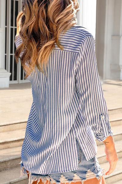 a woman wearing a blue and white striped shirt