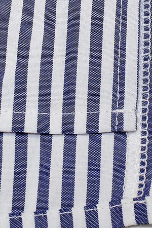 a close up of a blue and white striped shirt