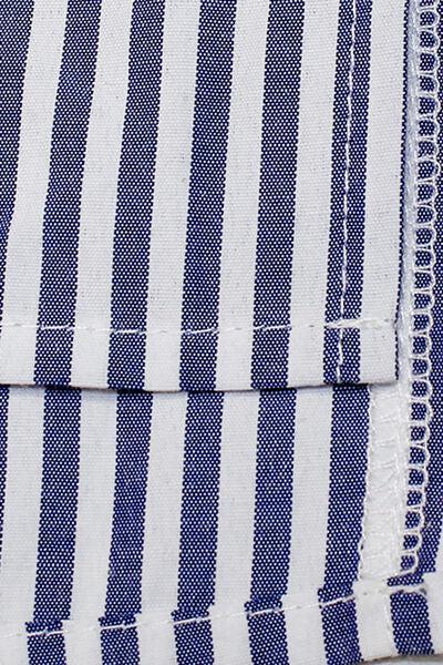 a close up of a blue and white striped shirt