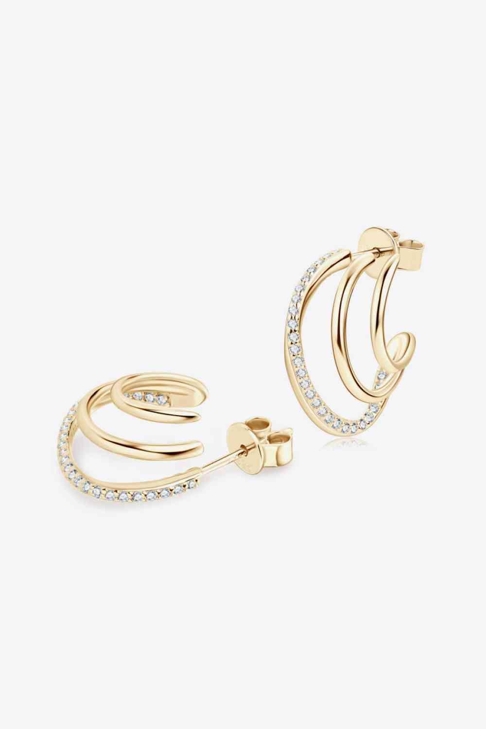 a pair of gold hoop earrings with diamonds