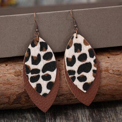 a pair of leopard print leather earrings