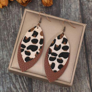 a pair of leopard print leather earrings