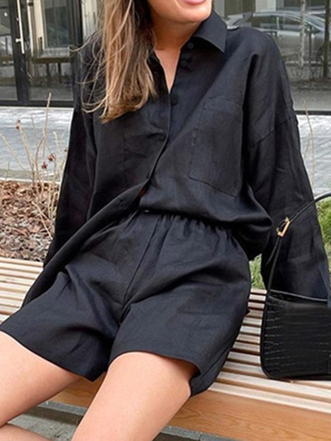 a woman sitting on a bench wearing a black shirt dress