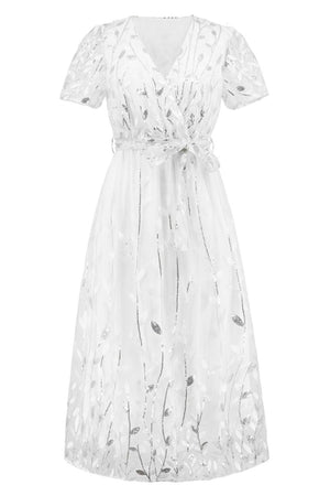 a white dress with flowers on it