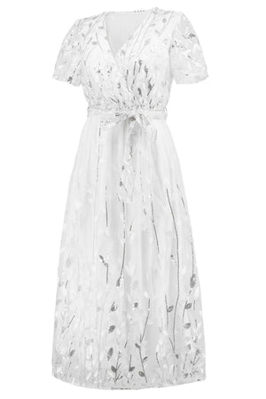 a white dress with a floral pattern on it