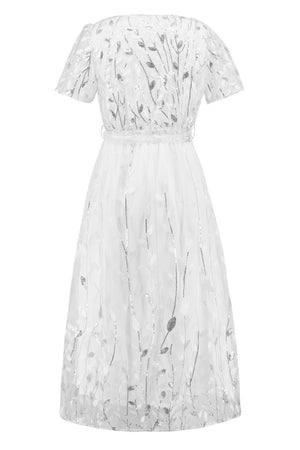 a white dress with flowers on it