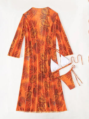 a woman's orange dress with matching accessories