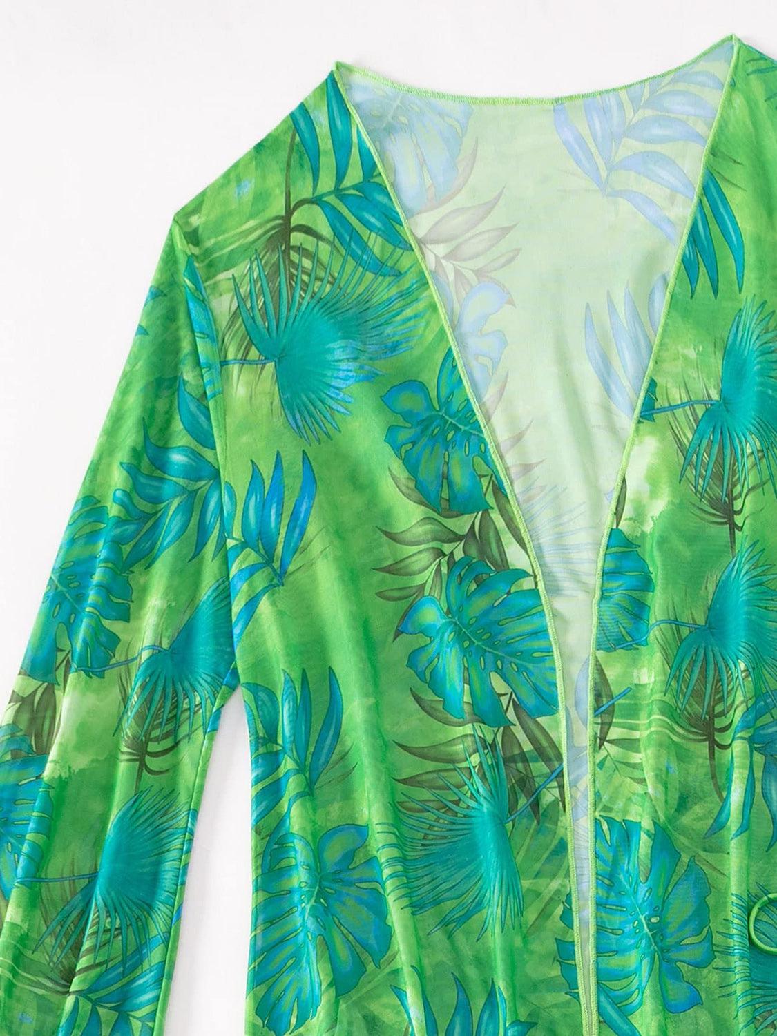 a green shirt with blue and green leaves on it