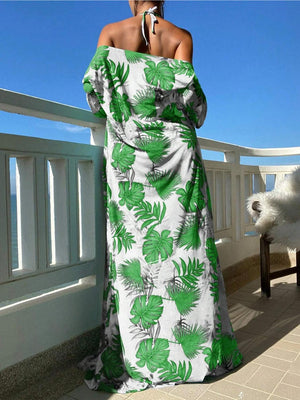 a woman in a green and white dress on a balcony