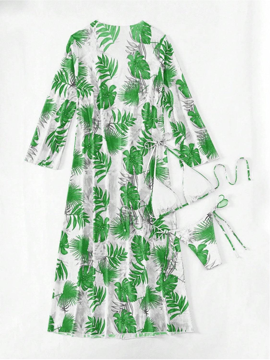 a green and white dress with palm leaves on it