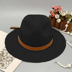 a black hat with a brown ribbon around the brim