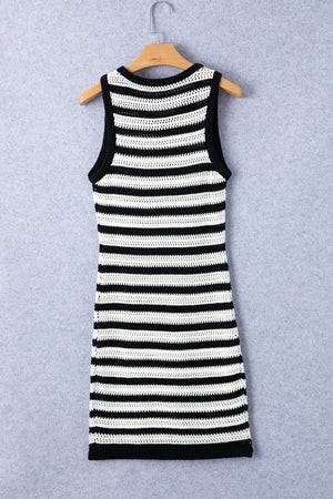 a black and white striped dress hanging on a hanger