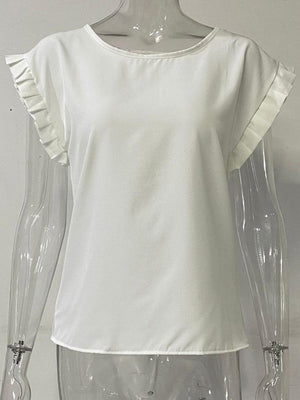 a mannequin wearing a white top with ruffled sleeves