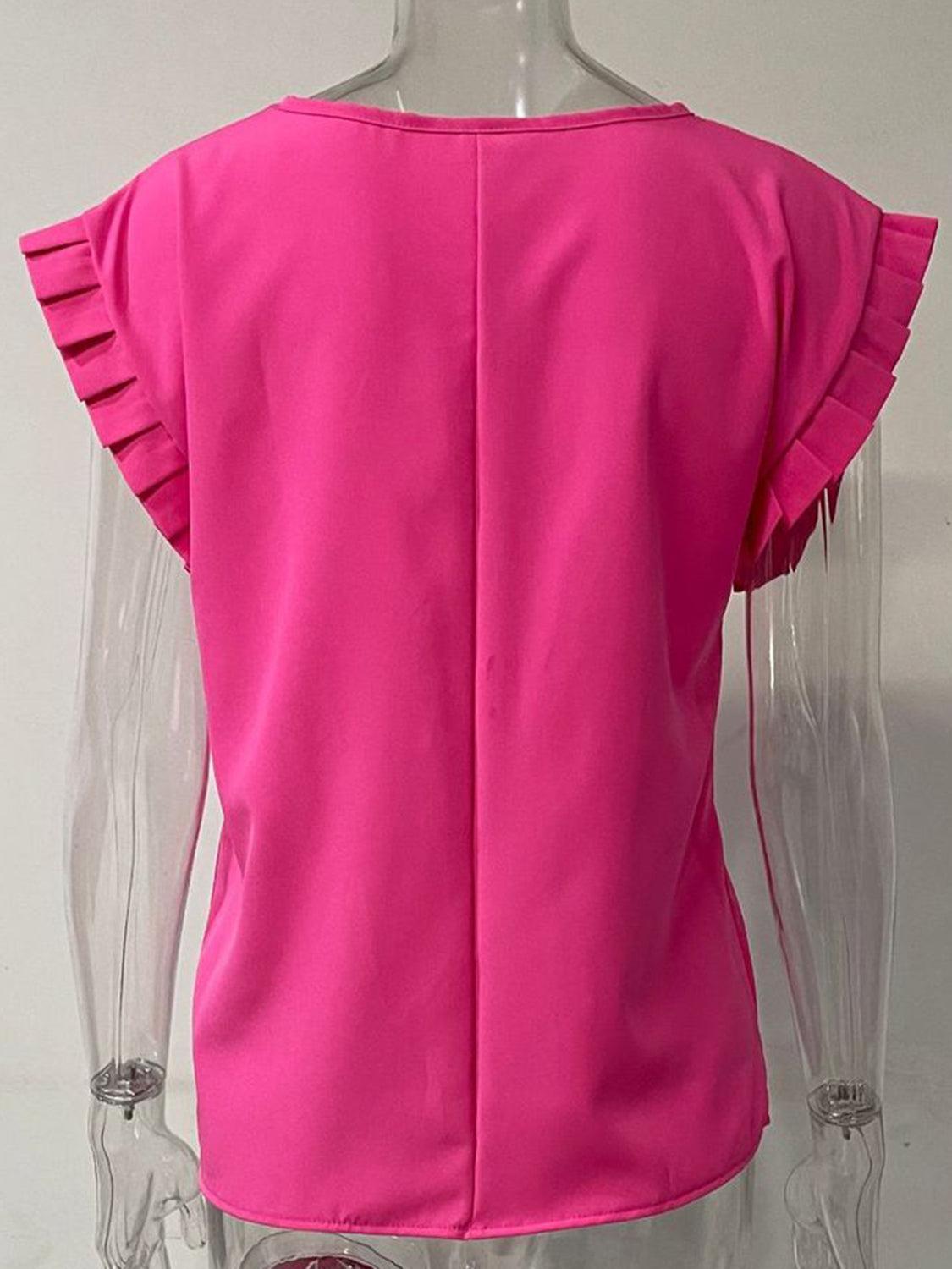 a mannequin wearing a pink top with ruffles