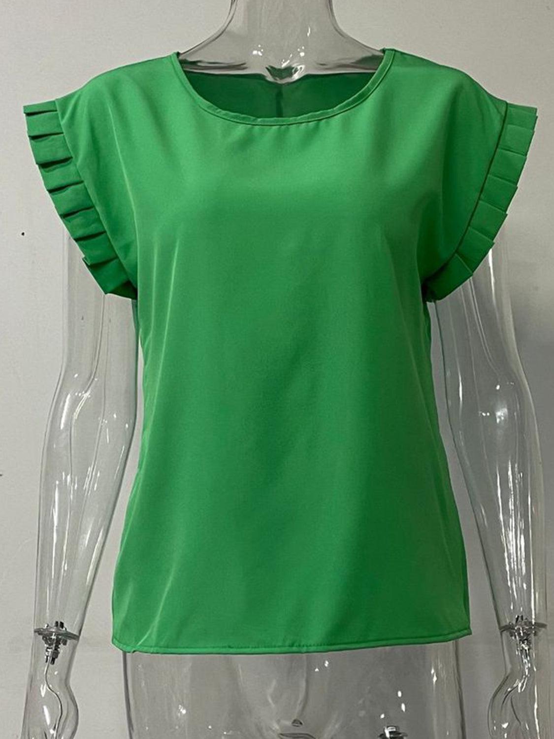 a mannequin wearing a green top with ruffles