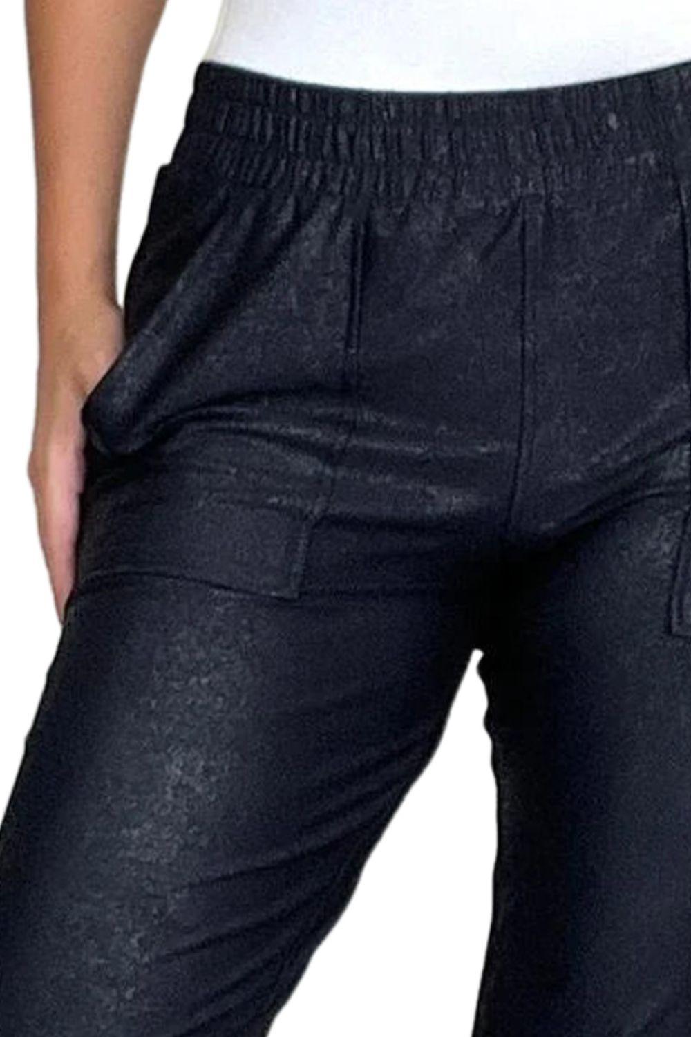 a close up of a person wearing black pants