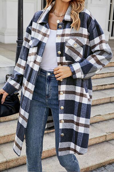 a woman wearing a plaid coat and jeans