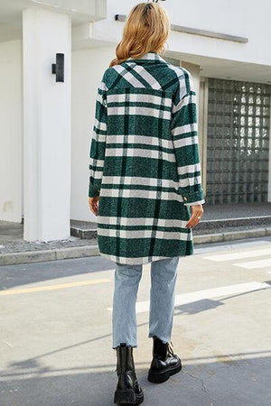 a woman in a green and white checkered coat