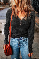 a woman standing on a sidewalk holding a purse