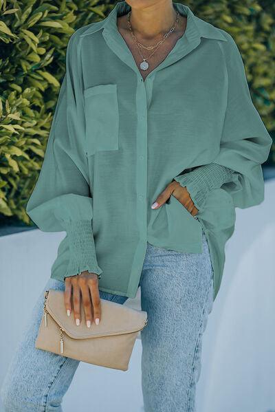 a woman wearing a green shirt and jeans