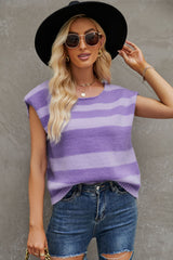 a woman wearing a purple and black striped top