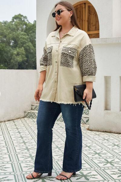 a woman in a leopard print shirt and jeans