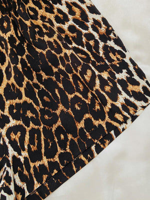 a close up of a black and brown animal print skirt