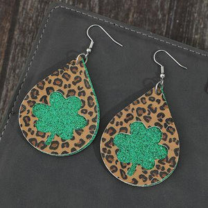 a pair of leopard print and green glitter earrings