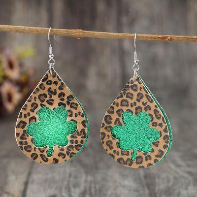 a pair of leopard print earrings with green glitter