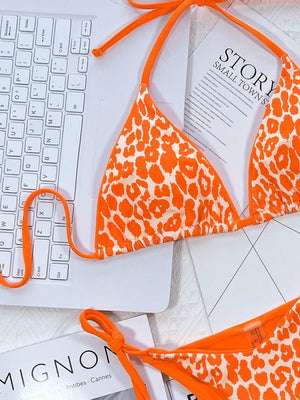 an orange and white bikini top and a keyboard