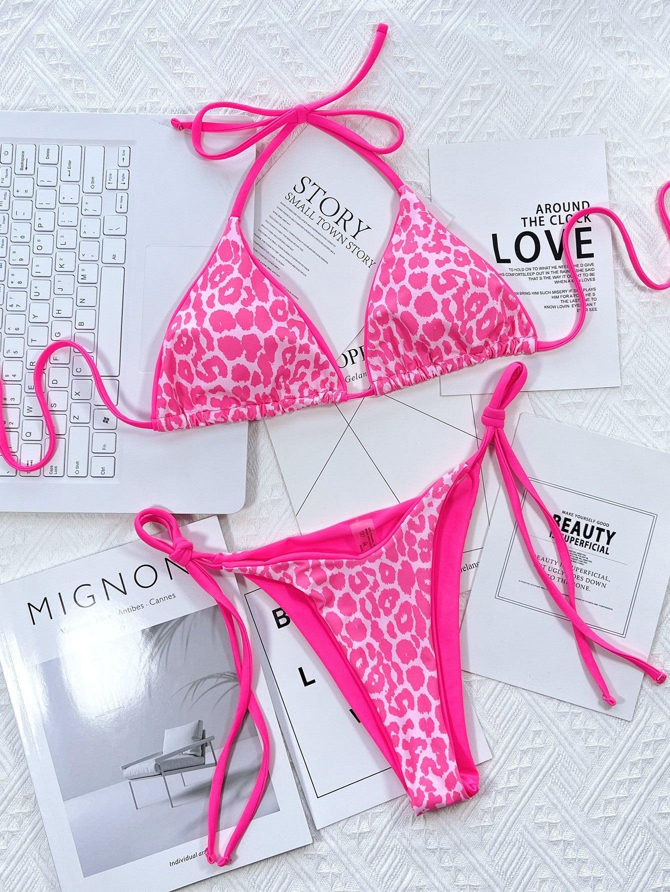 a pink and white bikini with a pink ribbon