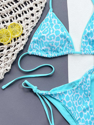 a blue and white bikini with a lemon slice