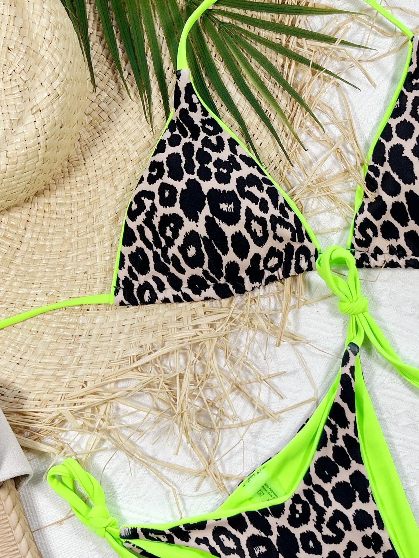 a bikini top with a green tie and a straw hat