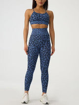 a woman in a blue leopard print sports bra top and leggings