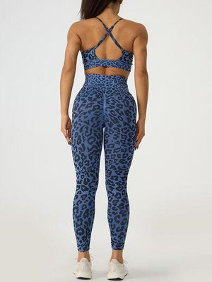 a woman in blue leopard print sports bra top and leggings