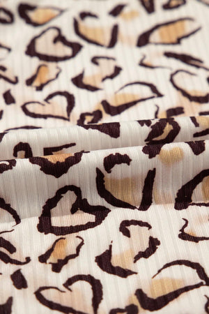 a close up of a white and brown animal print fabric