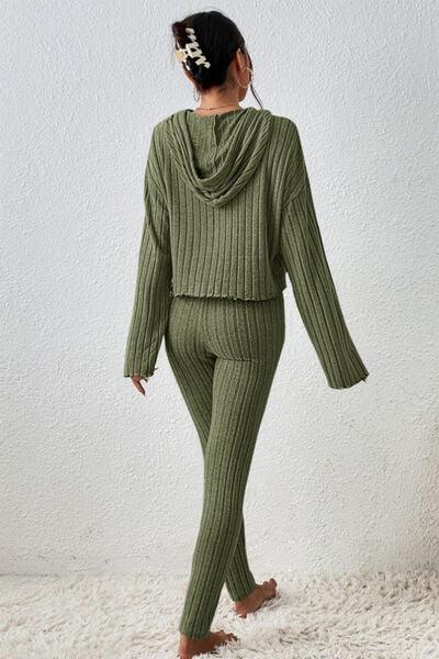a woman in a green sweater and pants