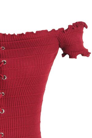 a close up of a red sweater with buttons