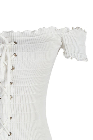 a close up of a white corset on a white background