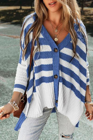 a woman wearing a blue and white striped cardigan