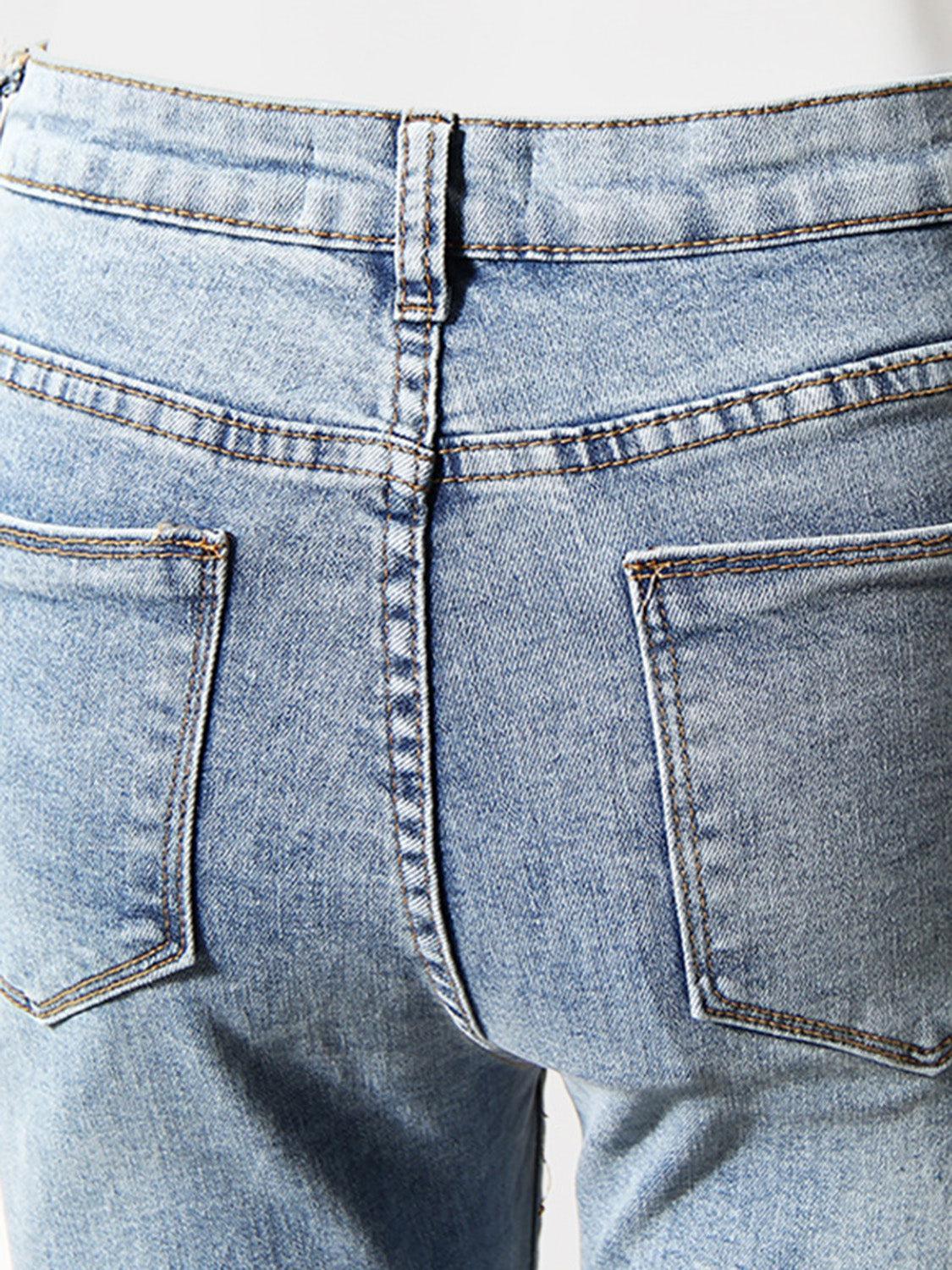a close up of a person's jeans with a cell phone in their pocket
