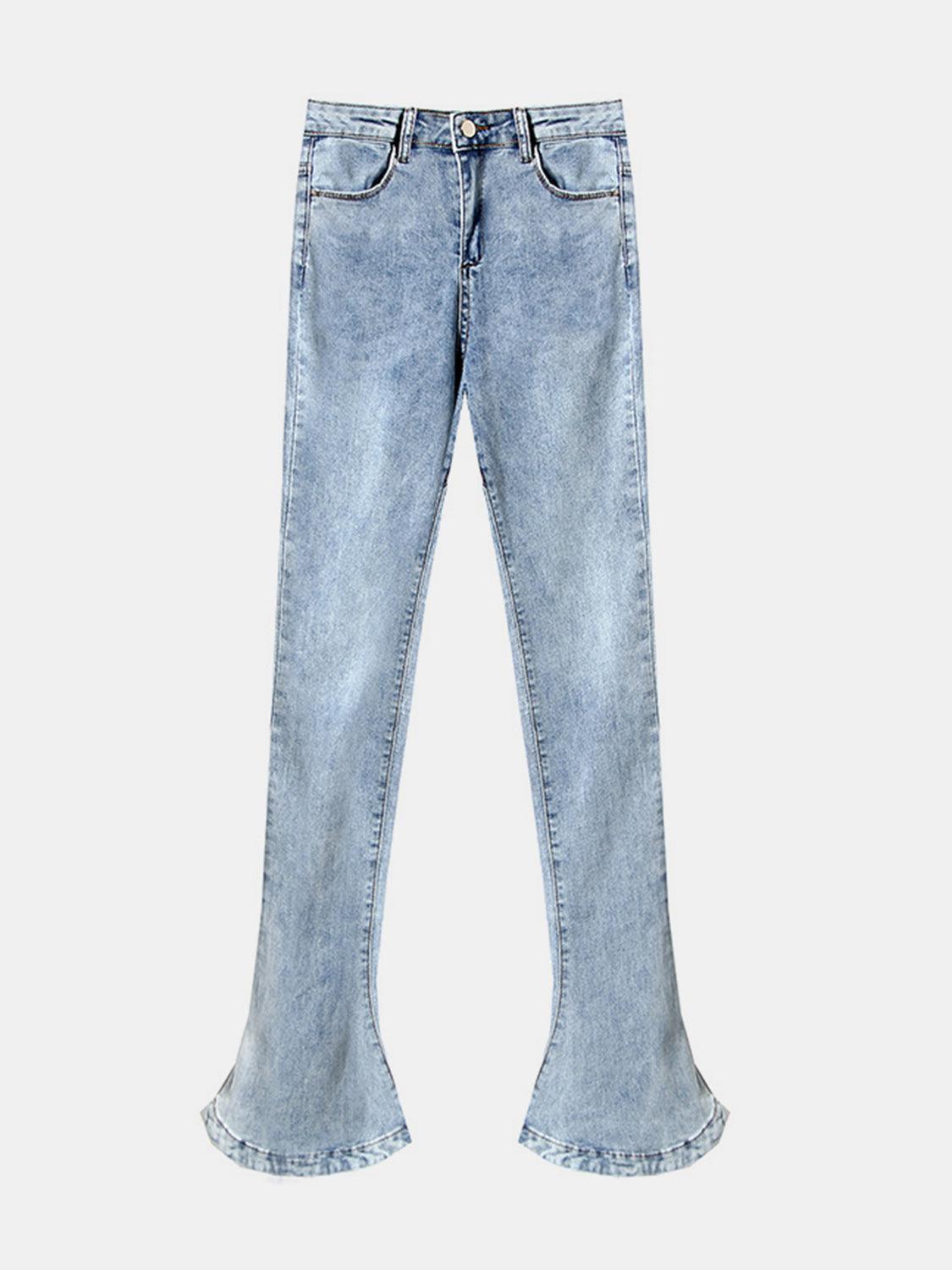 a pair of light blue jeans with ruffled hems