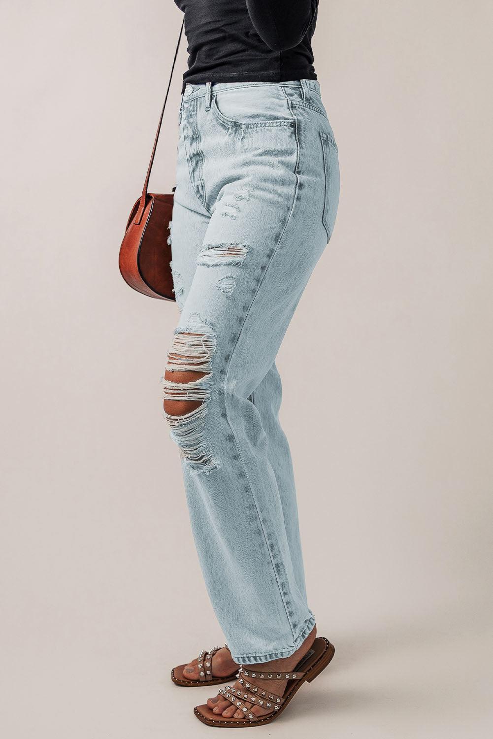 a woman in black shirt and jeans holding a brown purse